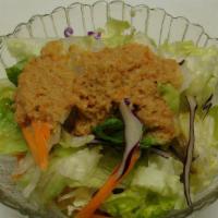 House Salad · Fresh garden greens with ginger dressing.