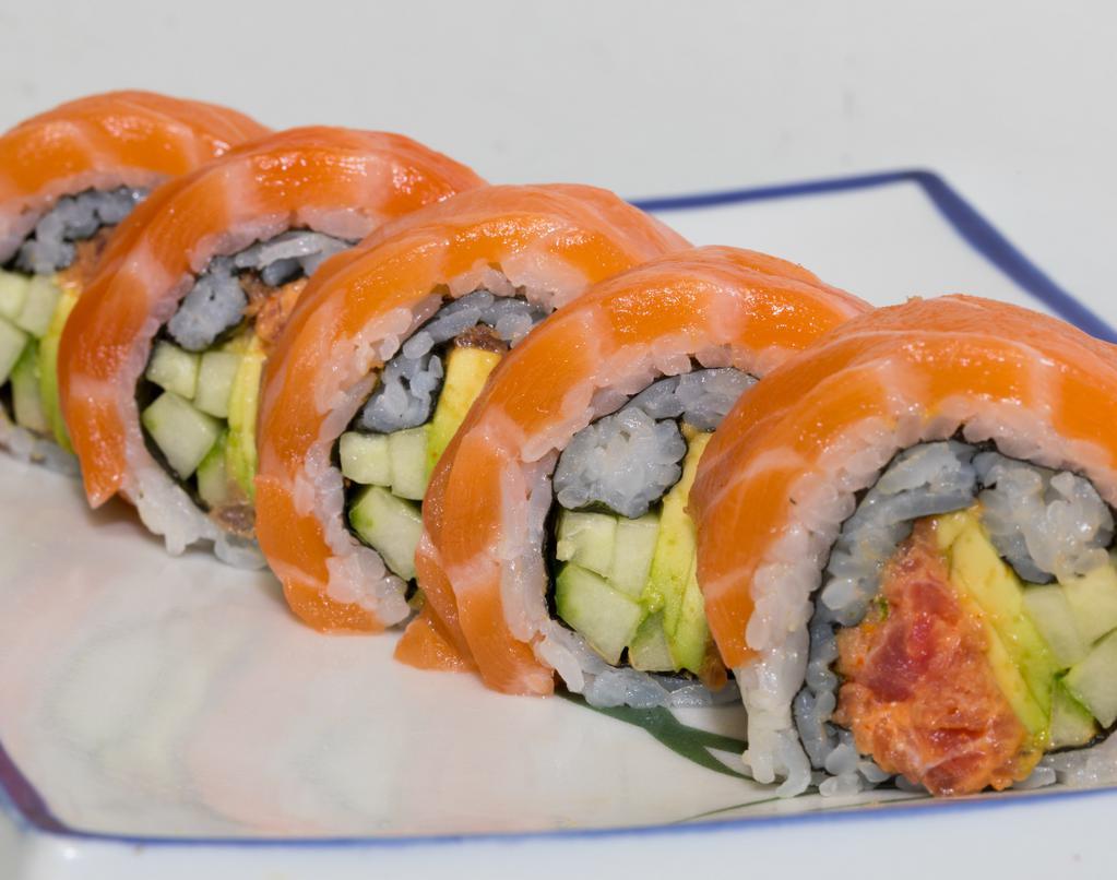 Chris Roll · spicy tuna, cucumber and avocado inside with salmon on top. Raw