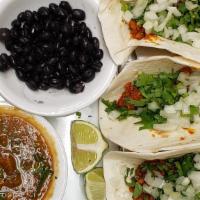 Tacos De Chorizo · New. Three corn tortilla tacos stuffed with soy chorizo. Topped with cilantro and onion.