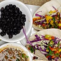 Beefless Tacos · New. Three corn tortillas stuffed with beefless ground, fresh cabbage, pico de mango, and li...