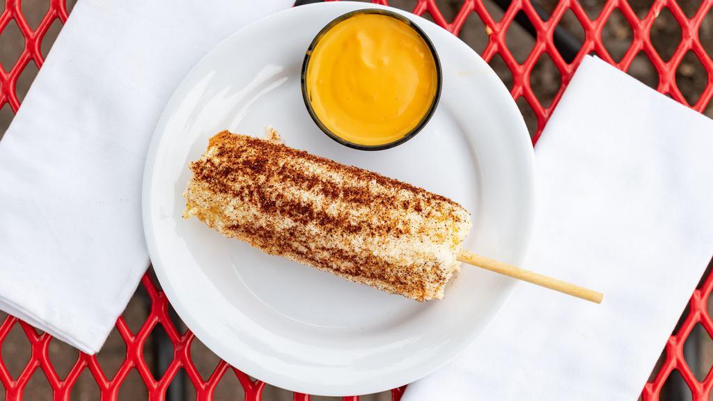 Street Corn · Mouth watering, warm, buttery elote corn seasoned and ready to eat.