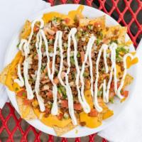 Loaded Nacho Supreme · Crunchy tortilla chips, all natural halal beef, warm nacho cheese, fresh pico de gallo, and ...