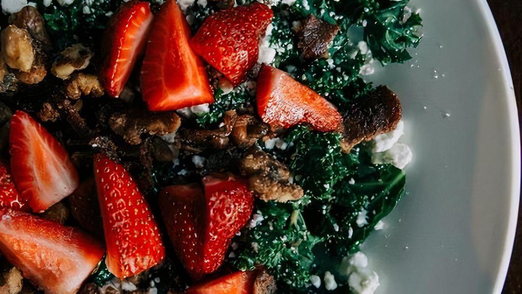 Strawberry Kale Salad · grilled kale, fresh strawberries, . chopped bacon, goat cheese, candied walnuts, tossed in balsamic vinaigrette