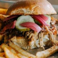 Goodwood Porker · smoked pulled pork, brioche bun, Goodwood BBQ sauce, pickled onions, pickles, side of slaw