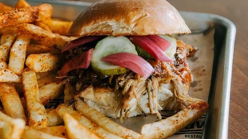 Goodwood Porker · smoked pulled pork, brioche bun, Goodwood BBQ sauce, pickled onions, pickles, side of slaw