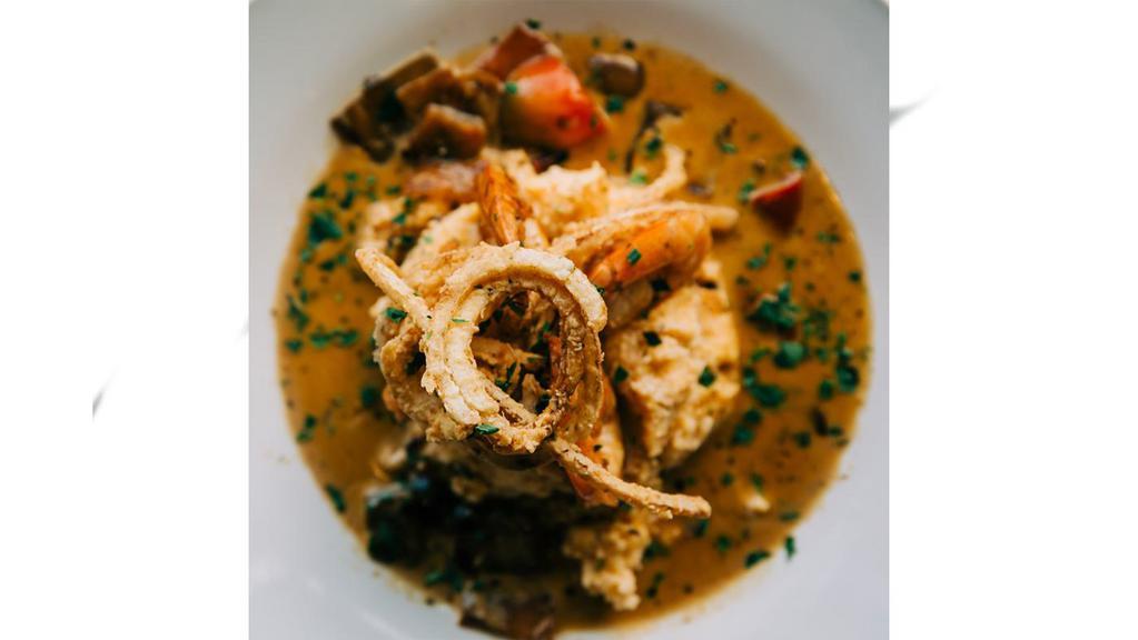 Shrimp And Grits · Weisenberger cheese grits, peppers and onions, creole cream sauce, crispy onions
