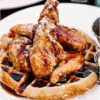Chicken And Waffles · crispy chicken, fluffy waffle, sweet chipotle honey syrup, honey butter, powdered sugar