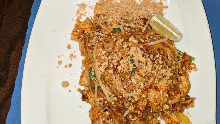 Pad Thai Noodles
 · Stir-fried noodles with egg, brown tofu, scallion, ground peanut, and bean sprouts.