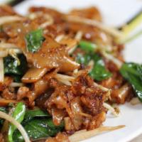 Pad See Ew · Large rice noodles stir-fried with sweet dark soy sauce, broccoli, and your choice meat.
