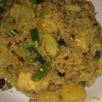 Pineapple Fried Rice · Shrimp fried rice flavored with pineapple, cashews, and scallions.
