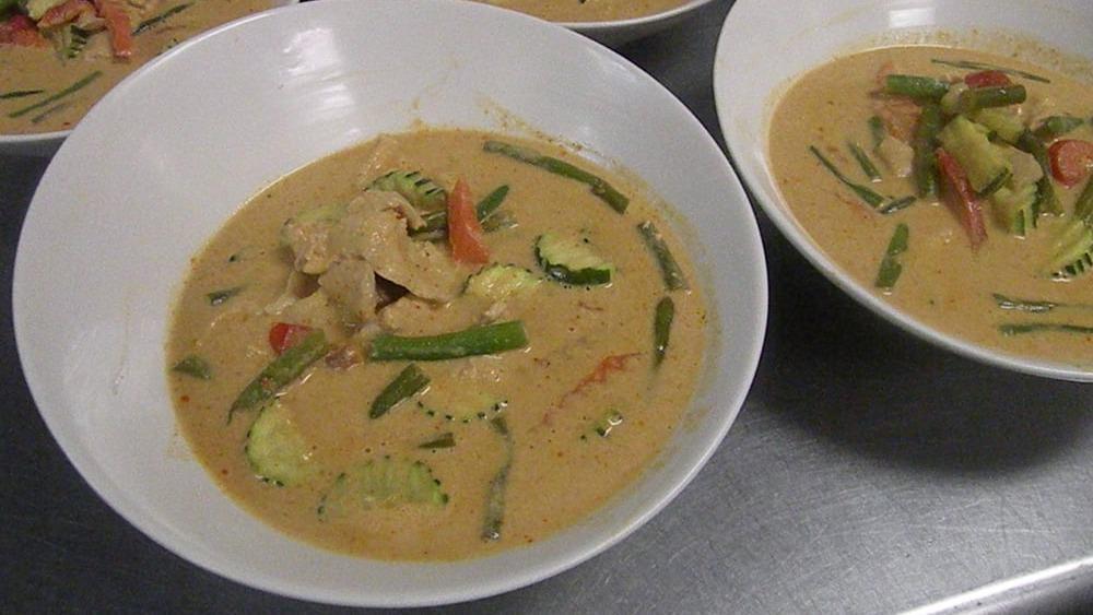 Red Curry
 · Spicy. Red curry with coconut milk, lime leaves, bamboo shoot, red peppers, string beans, and basil. Hot and spicy.