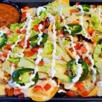 Wings Etc'S Ultimate Nachos · Enough for 4—unless you’re REALLY hungry! Chili, lettuce, tomato, onions, fresh jalapeño, li...
