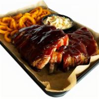 Full Rack Hardwood-Smoked Rib Dinner · With House BBQ sauce, and choice of 2 sides