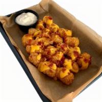 Loaded Tater Tots Full Order · Nacho Cheese, sour cream, & bacon bits