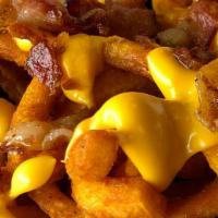 Loaded Straight Fries Half Order · Nacho Cheese, sour cream, & bacon bits