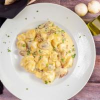 Tortellini Alla Panna · Cheese tortellini sautéed with prosciutto, mushrooms, onions, green peas, and light cream sa...