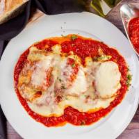 Eggplant Rolls · Eggplant stuffed with ricotta cheese and spinach baked in marinara sauce and mozzarella chee...