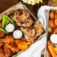 Rookies Famous Wings · Served with bleu cheese or ranch, celery and carrots, tossed with choice of dip sauce.