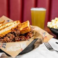 Beef Brisket Melt · Slow-roasted beef brisket, cheddar cheese, grilled onions and windy city BBQ sauce on grille...