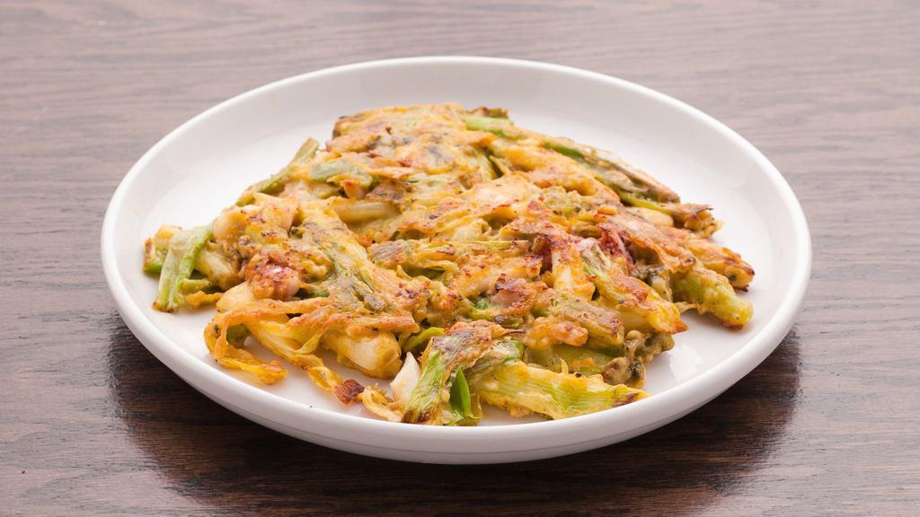 Pa-Jeon · Savory Korean-style pancake with green onions and seafood.