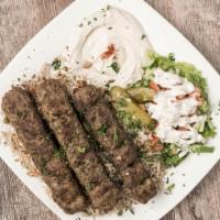 Beef Kafta Plate · Hamati hand carved marinated ground beef flavored with crusted red peppers flamed over open ...