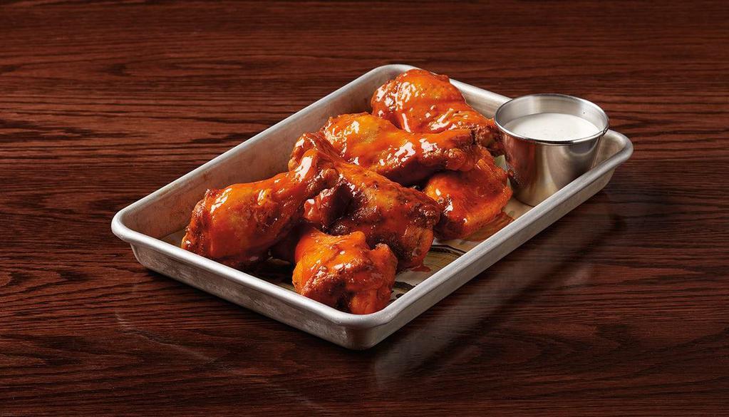 Wings · choose from traditional or boneless BBQ, buffalo or sweet chili glazed wings served with ranch or blue cheese dressing
