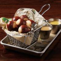 Pretzel Bites · mini pretzel bites sprinkled with Parmesan cheese & served with housemade Boston beer cheese...