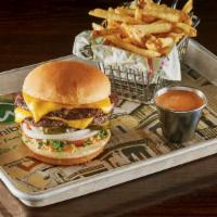 The Double Decker · Move into a Double Decker with TWO 1/4 lb. burger patties! lettuce, tomato, onion, governmen...