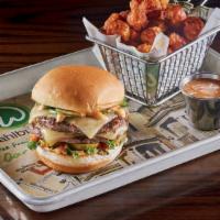 The Fiesta Burger · two 1/3 lb. burger patties dusted with housemade Southwestern spice rub, fresh jalapeños, le...