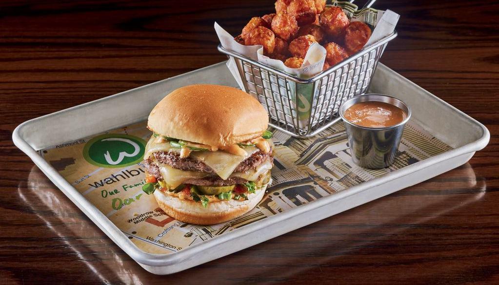 The Fiesta Burger · two 1/3 lb. burger patties dusted with housemade Southwestern spice rub, fresh jalapeños, lettuce, pepper jack cheese, housemade salsa, chipotle mayo & pickles