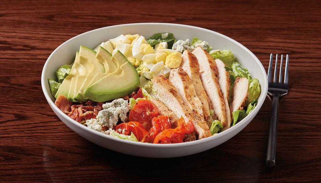 Cobb Salad · marinated seared chicken, mixed greens, roasted cherry tomatoes, hard-boiled egg, crumbled blue cheese, avocado slices & bacon bits served with housemade blue cheese dressing