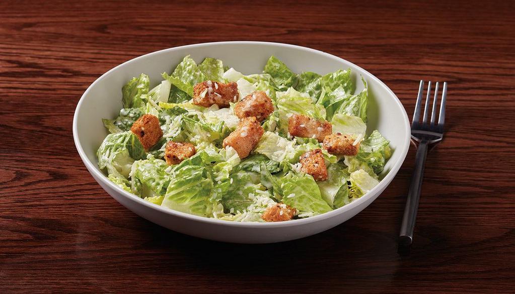 Caesar Salad With Chicken · fresh romaine, housemade croutons. & Parmesan cheese served with Caesar. dressing. with marinated seared chicken breast.