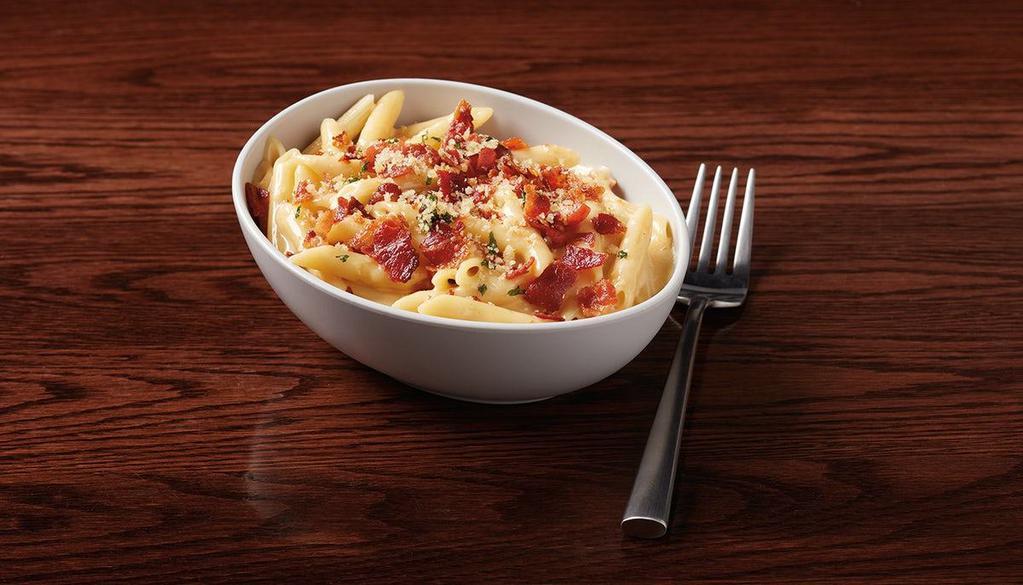 Bacon Mac-N-Cheese · mini penne, smoked bacon & signature cheese sauce topped with housemade garlic Parmesan panko bread crumbs