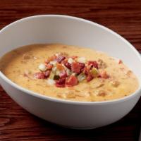 Cheeseburger Chowdah · fresh ground beef, onions, bacon, potatoes & government cheese in a creamy soup topped with ...