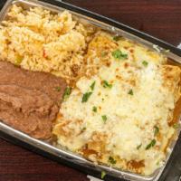 Enchiladas · Muncheez specialties. Seasoned Beef or Chicken rolled in a corn tortilla and topped with Bee...