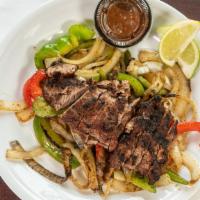 Fajitas · Muncheez specialties. Your choice of Marinated Chicken Breast or Strip Steak, Bell Peppers, ...