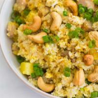 Pineapple Curry Fried Rice · Rice with eggs, pineapple, white onion, cashew nuts, carrots, and curry spice stir-fried in ...