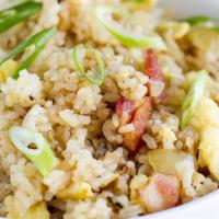 Bacon Fried Rice · Rice with eggs, white onions, carrots, pea pods, and bean sprouts stir- fried in black sauce.