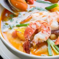 Tom Yum · Chicken, green onion, cilantro, mushrooms, and tomatoes in spicy and sour broth. Add shrimp ...