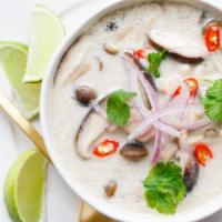 Tom Kha Gai · Chicken, mushroom, green onion, and cilantro in herbal coconut broth. Add shrimp for additio...