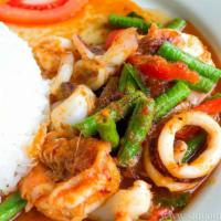 Seafood Curry · Basil, onions, bamboo, green/red pepper, broccoli, crab, shrimp, squid, scallops in red curry.