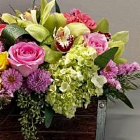 Mixed Floral Box · Vibrant green ,pink ,lavender and touch of yellow blooms in keepsake box. Approximately what...