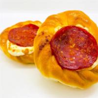 Mini Pepperoni & Cheese Pie · Classic Lebanese cheese pie with pizza sauce, topped with pepperoni