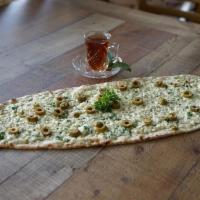 Long Cheese Sanbusek · Lebanese long flatbread topped with herbed mozzarella cheese and chopped parsley, seasoned w...