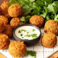 Falafel With Veggies (By The Dozen) · Deliciously deep-fried patties made from pureed chickpeas with a side of veggies