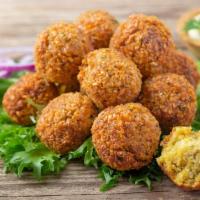 Falafel (By The Piece) · Deliciously deep-fried patties made from pureed chickpeas