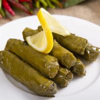 Stuffed Grape Leaves (Vegetarian) · Classic Lebanese dish of grape leaves perfectly stuffed with white rice and vegetables.