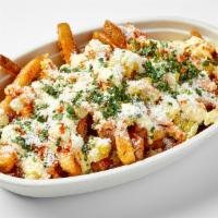 Takis® Elote Fries · Seasoned battered fries, topped with our elotes slathered in butter, chipotle mayo, and cove...