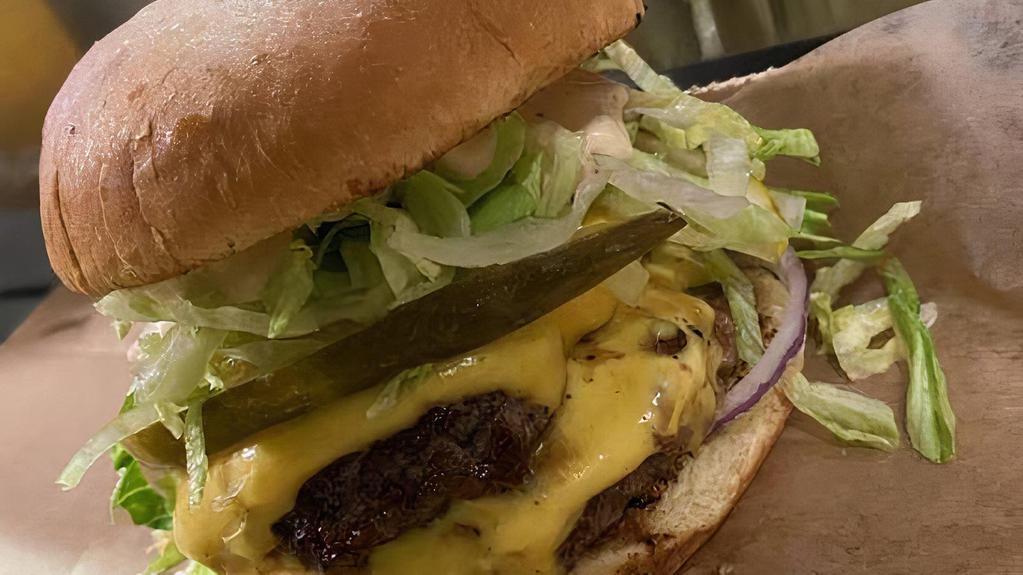 The Original Smashed Burger · Secret sauce, pickle, red onion, shaved lettuce, american cheese.
