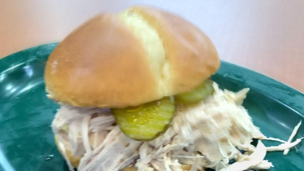 Pulled Chicken Sandwich · Dad’s pulled chicken, pickles and BBQ sauce
